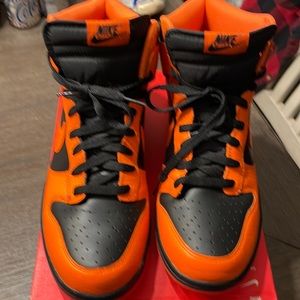 Nike- Big Nike High. Size 12. Black and orange.